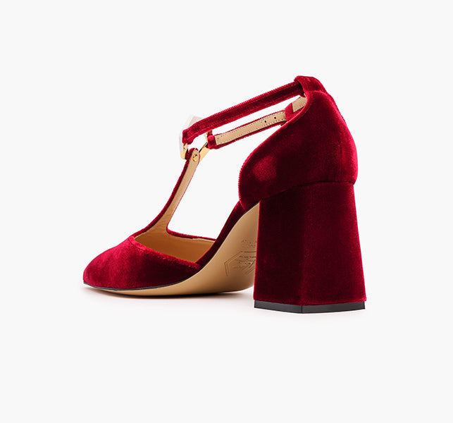 Elegant red pumps with architectural buckle