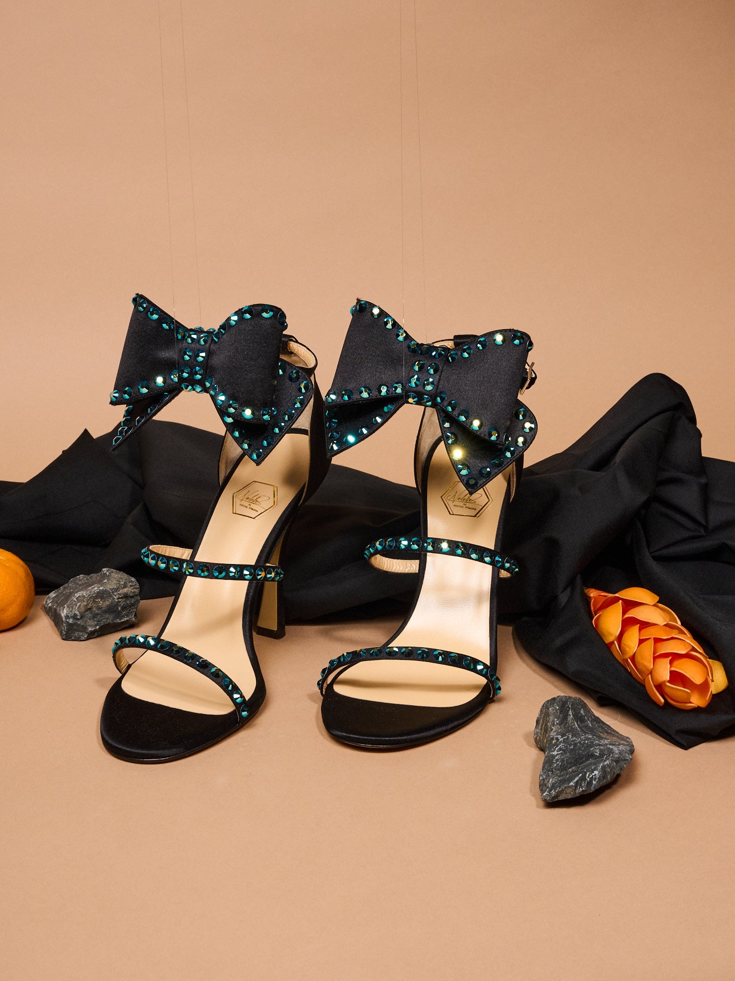 Artisan-crafted black heels with bold silhouette